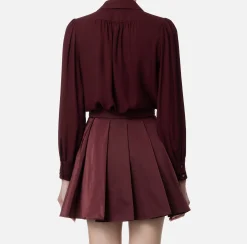 Blusa in georgette con charms collana