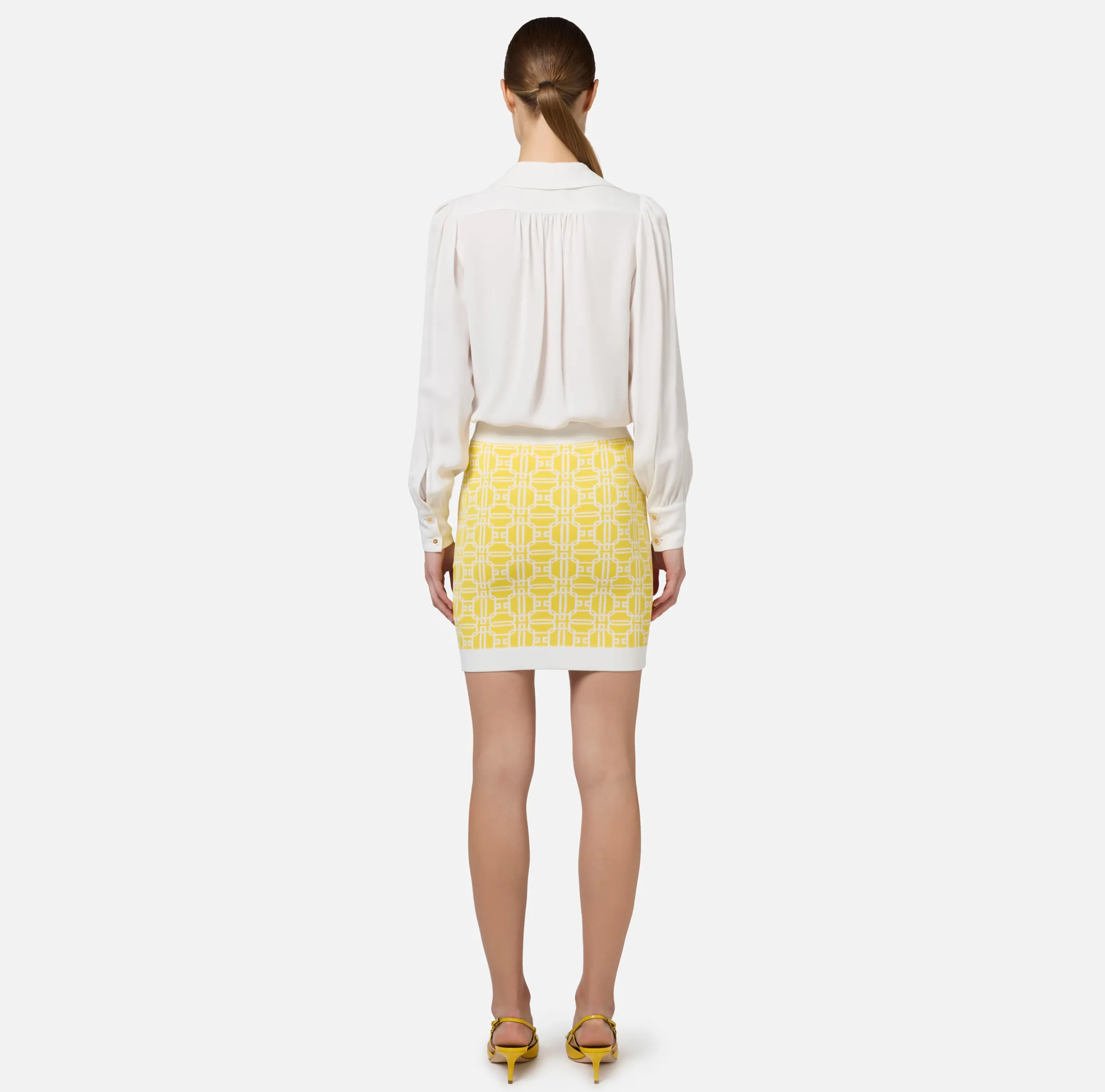 Blusa in georgette con charms collana