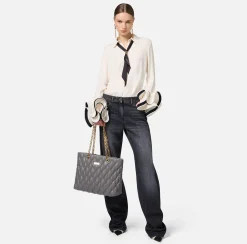 Jeans a gamba larga in cotone organico con bande in raso