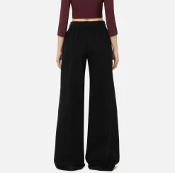 Jeans a gamba larga in cotone tinto con pinces
