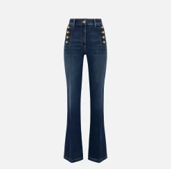 Jeans a zampa in cotone stretch con bottoniera laterale