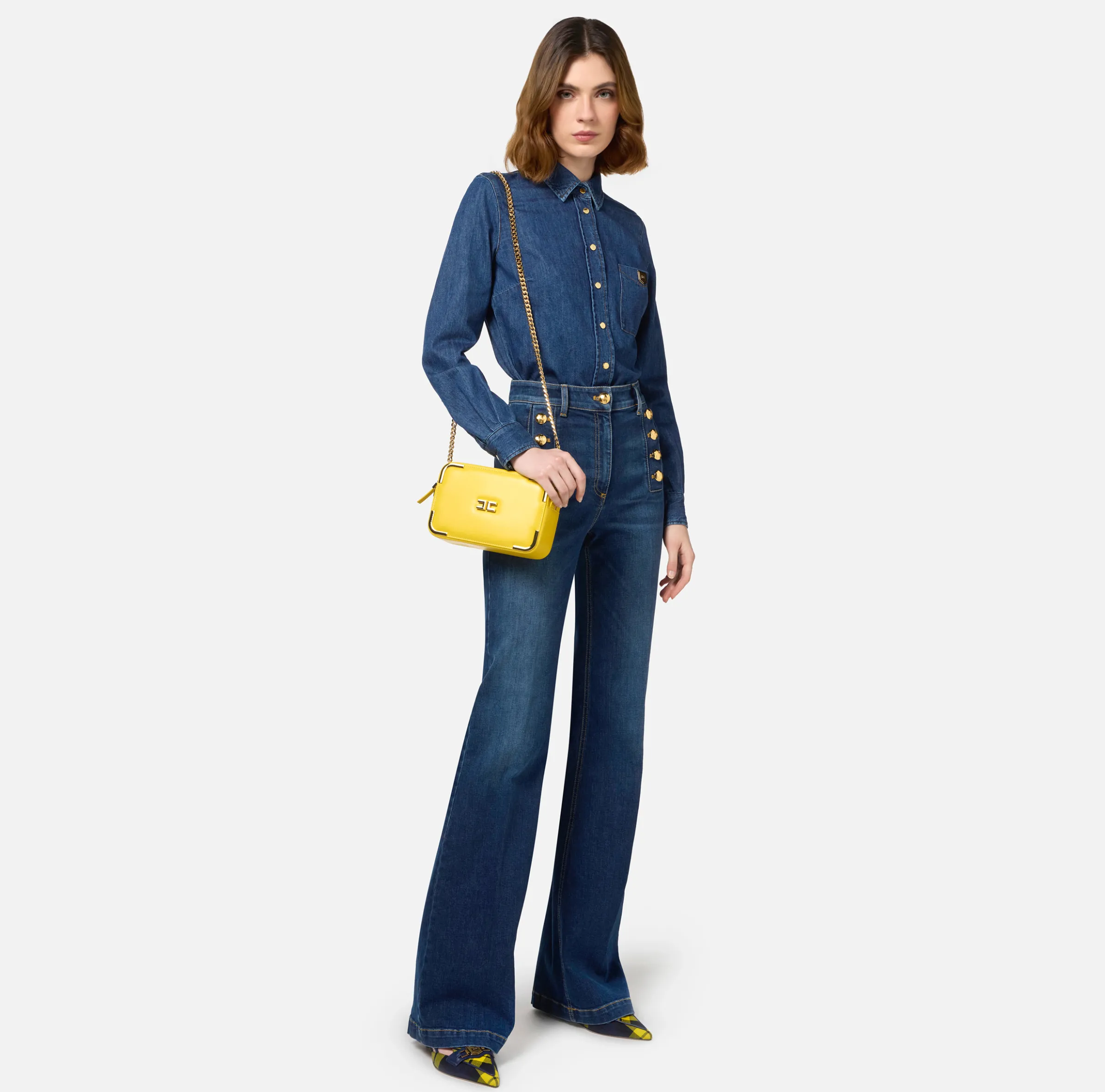 Jeans a zampa in cotone stretch con bottoniera laterale