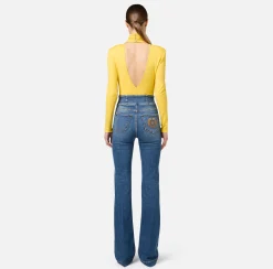 Jeans a zampa in cotone stretch con bottoniera centrale
