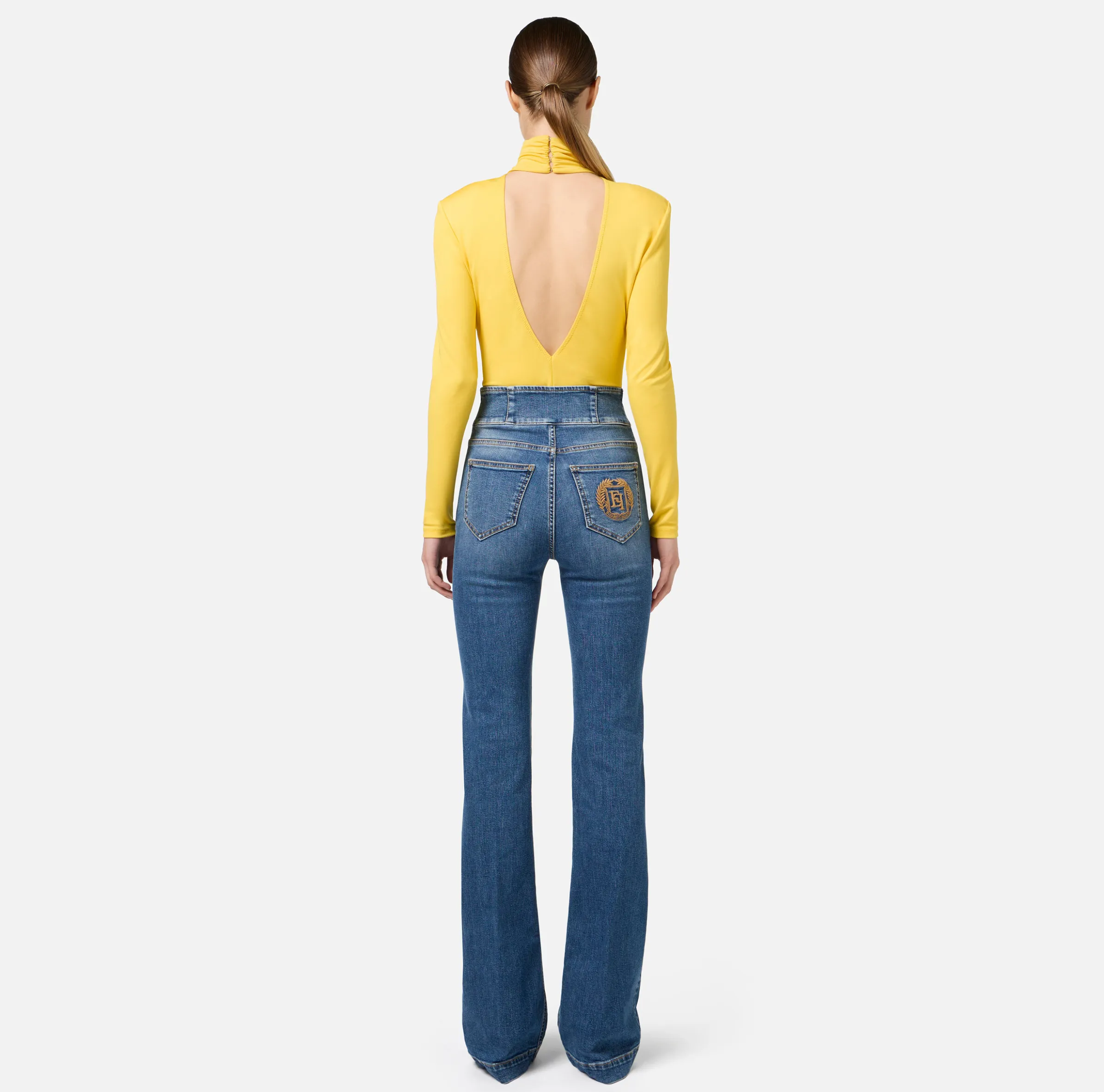 Jeans a zampa in cotone stretch con bottoniera centrale