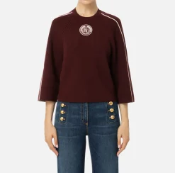 Maglia cropped in viscosa con patch logo