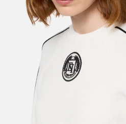 Maglia cropped in viscosa con patch logo