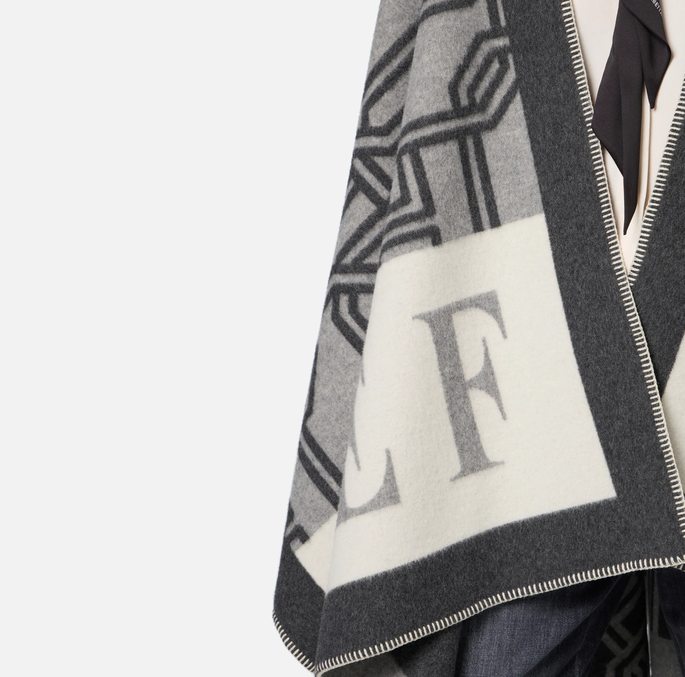Mantella in lana jacquard con lettering