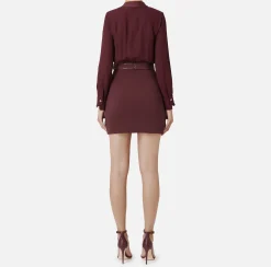 Miniabito con camicia incrociata e gonna con tasche