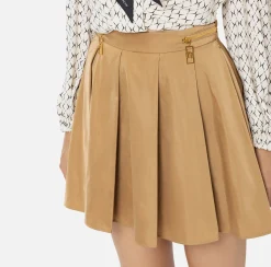 Minigonna a pieghe in nylon tecnico con zip