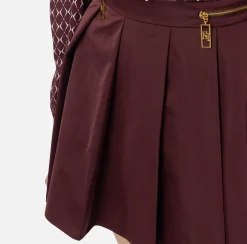 Minigonna a pieghe in nylon tecnico con zip