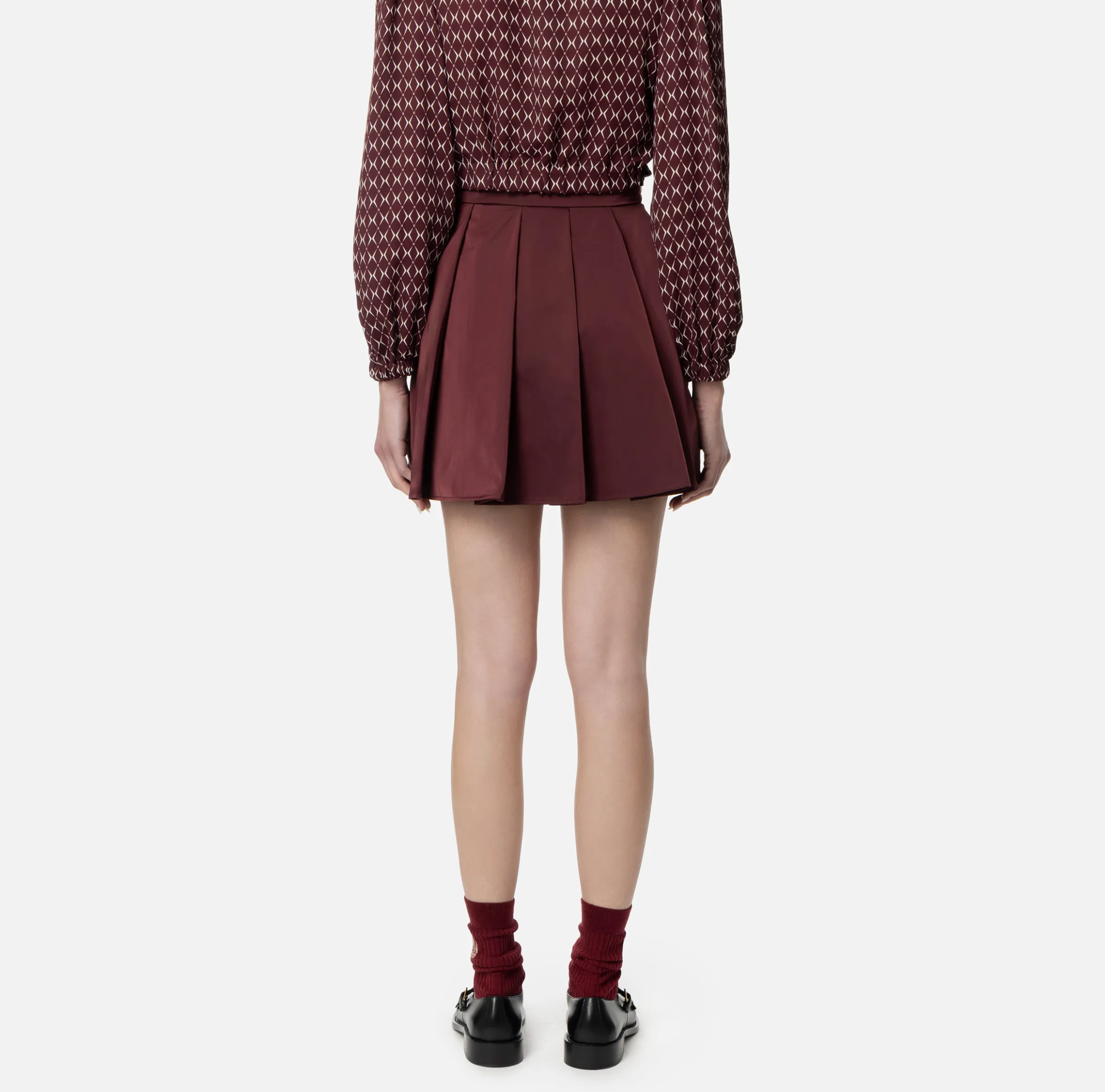 Minigonna a pieghe in nylon tecnico con zip