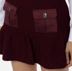 Minigonna in lana bouclé con tasche in vela tecnica