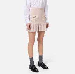 Minigonna in lana bouclé con tasche in vela tecnica