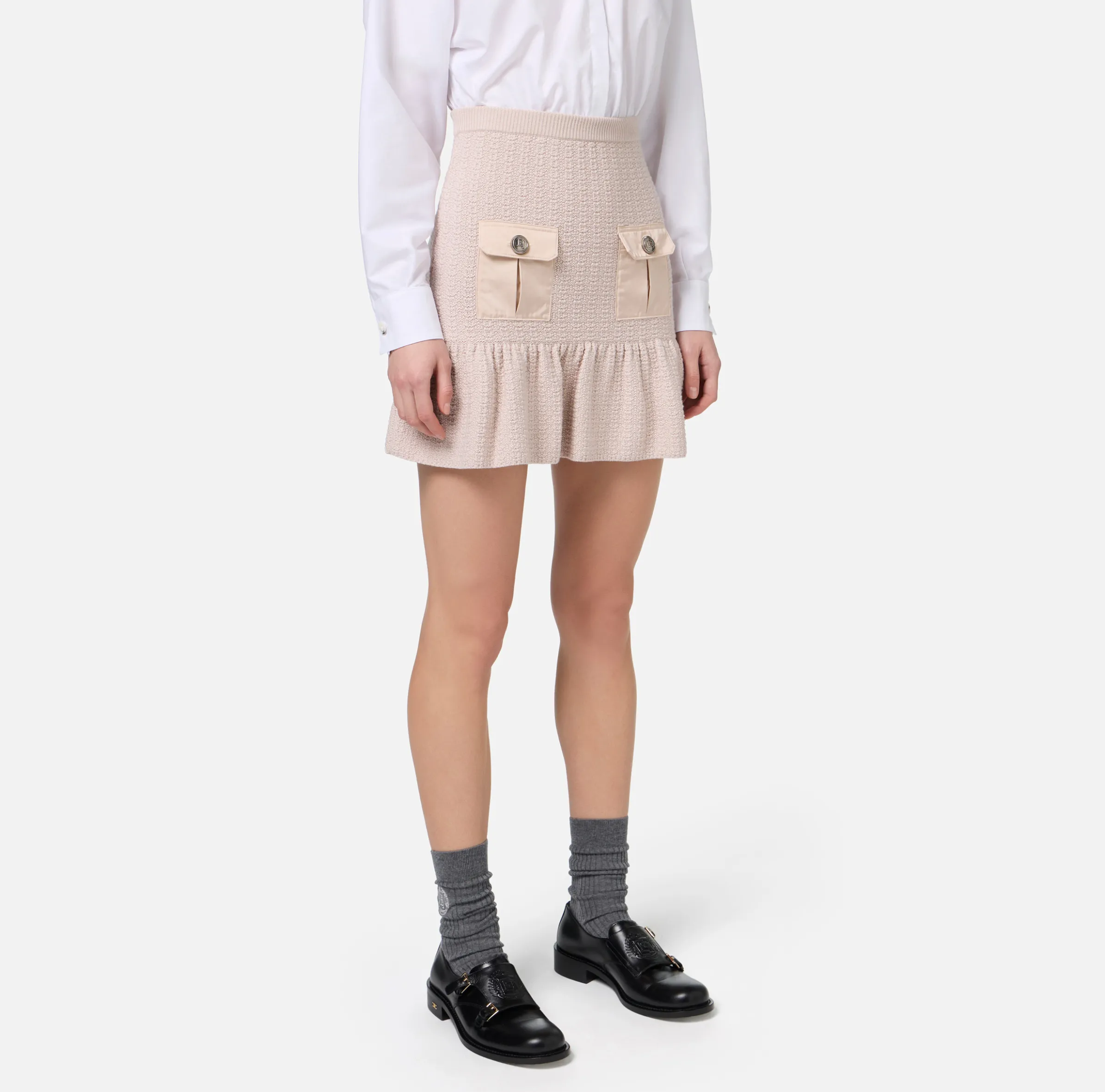 Minigonna in lana bouclé con tasche in vela tecnica