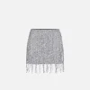 Minigonna in tulle ricamata con frange di paillettes