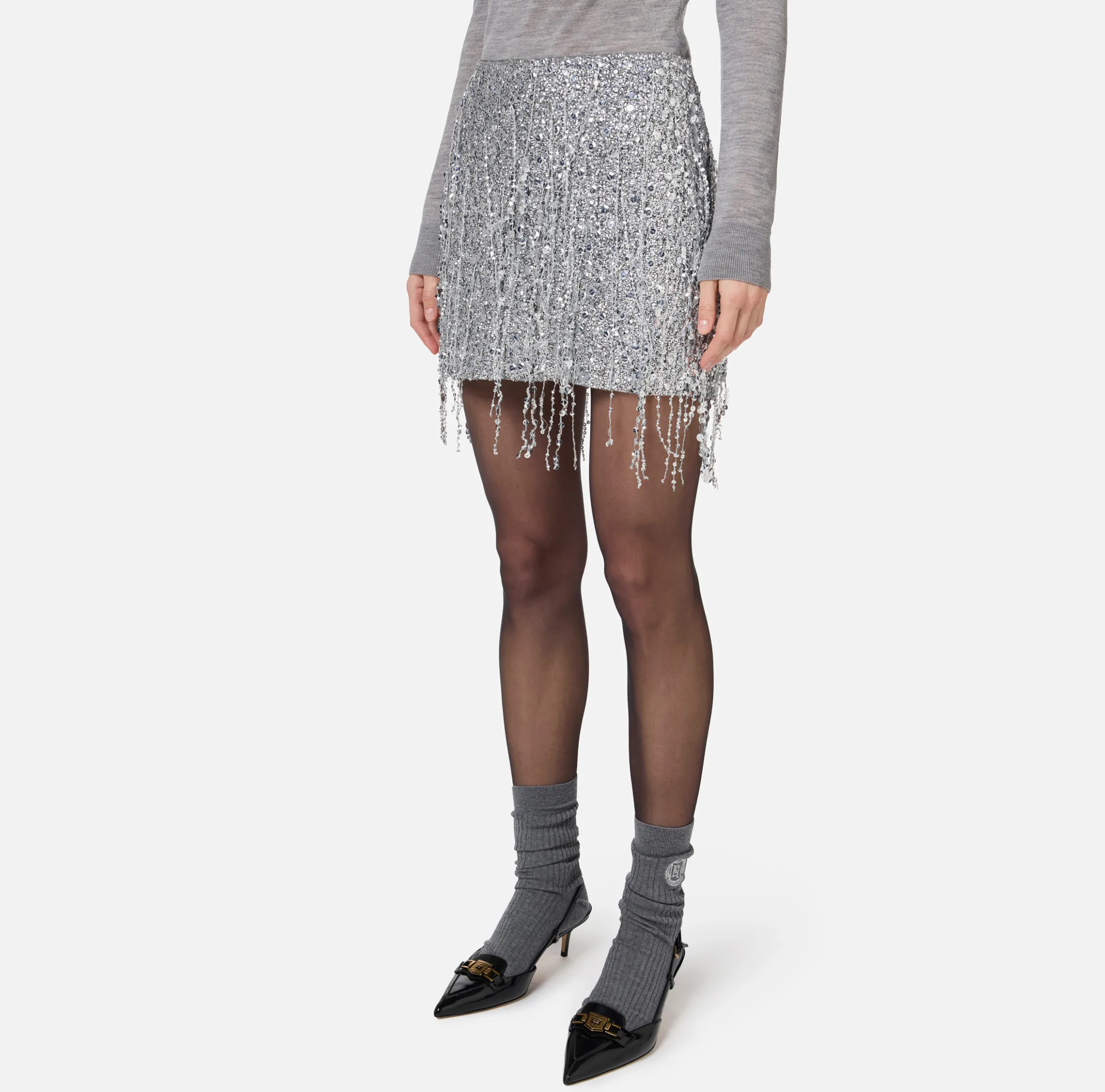 Minigonna in tulle ricamata con frange di paillettes