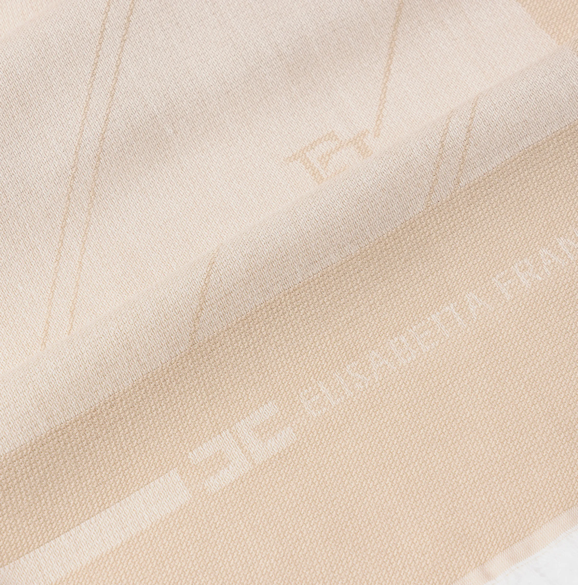 Pashmina in jacquard lurex con pattern righe diagonali e logo