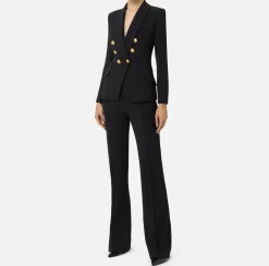 Tailleur in doppio crêpe stretch con giacca sciallata e pantalone a palazzo