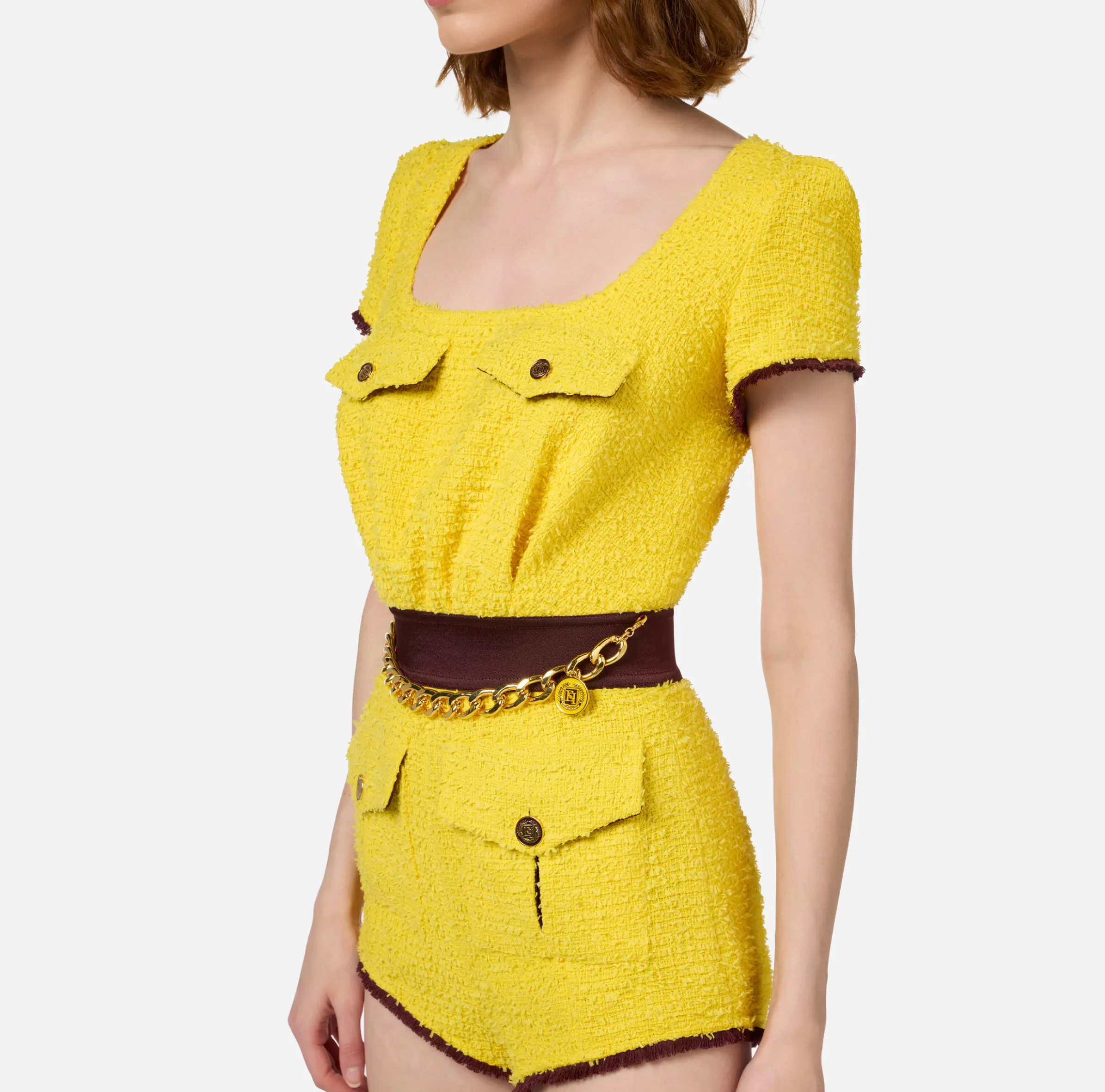 Tuta corta in tweed con tasche