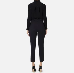 Tuta in crêpe stretch con fiocco