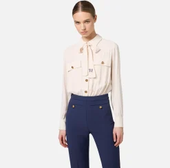 Tuta in crêpe stretch con fiocco