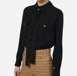 Tuta in crêpe stretch stampa rombo con fiocco