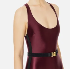 Tuta in lycra lucida con elastico logato