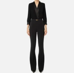 Tuta in viscosa con camicia incrociata e pantalone svasato con morsetto