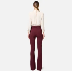 Tuta in viscosa con camicia incrociata e pantalone svasato con morsetto